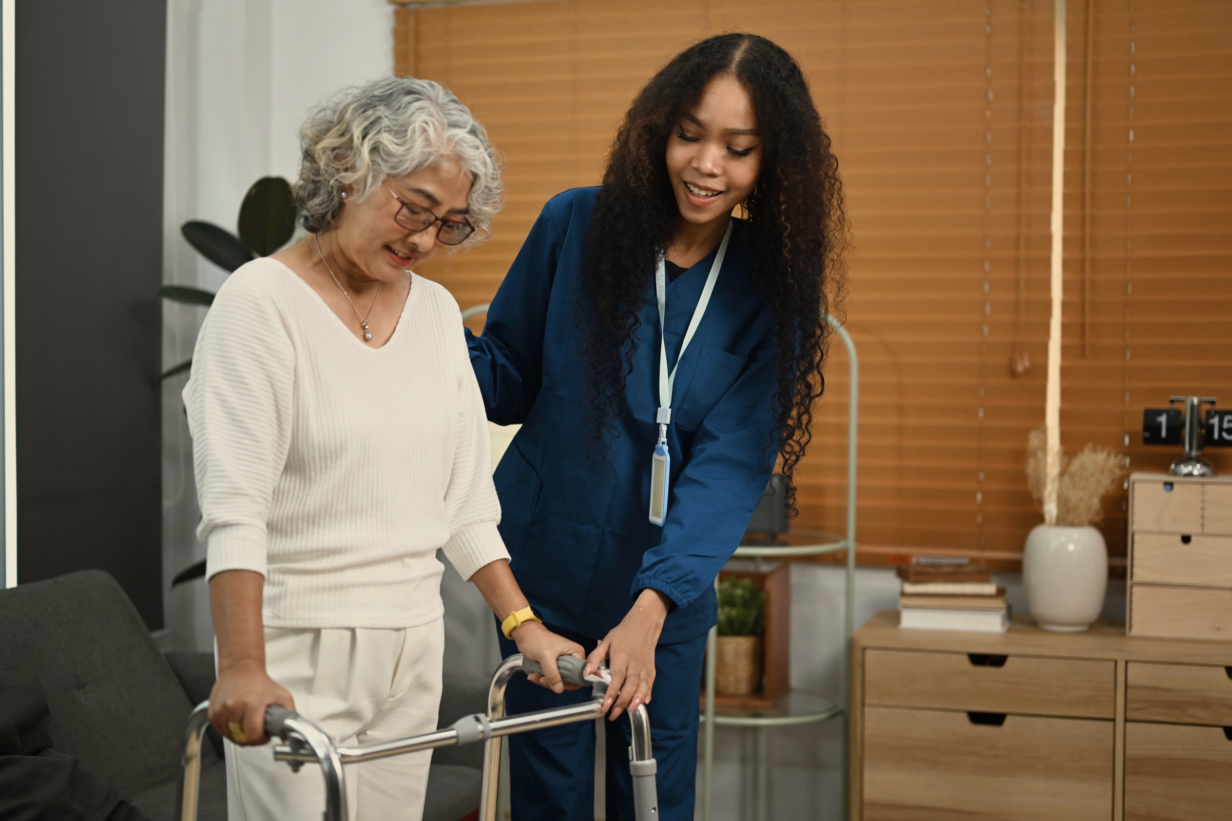 A carer alongside a resident, mid conversation